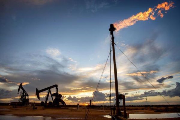 em092419a/a/Methane gas is burned off at a site of 3 oil wells east of Carlsbad in Lea County, Tuesday September 25, 2019.  (Eddie Moore/ Albuquerque Journal)